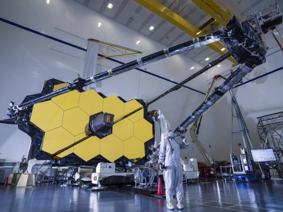 Worker in front of James Webb Space Telescope